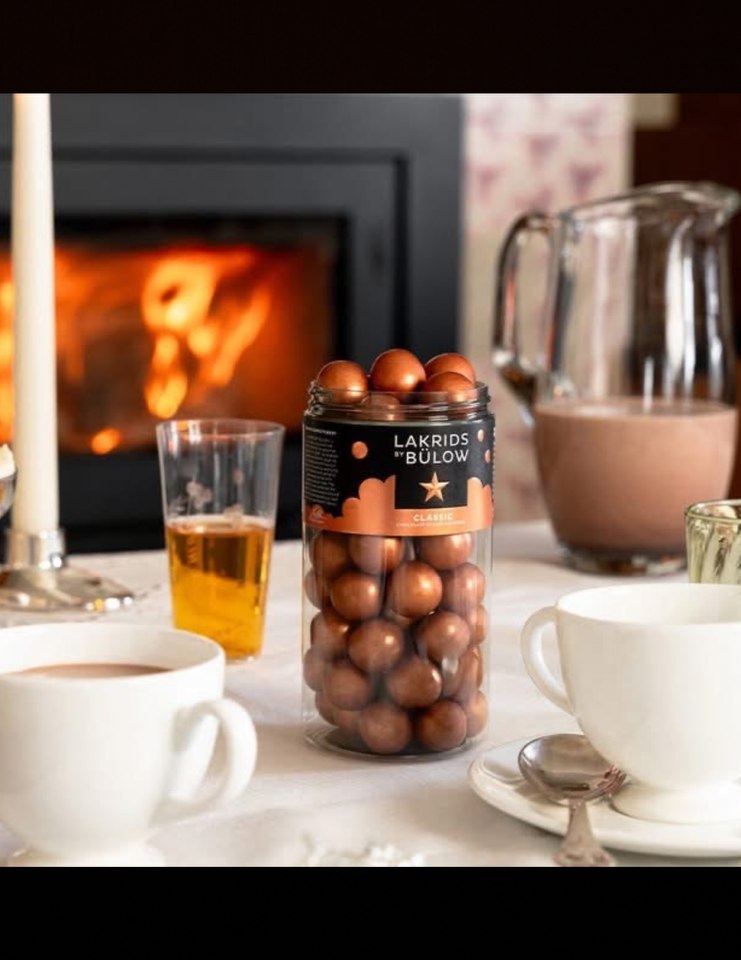 gold licorice balls on table with coffee